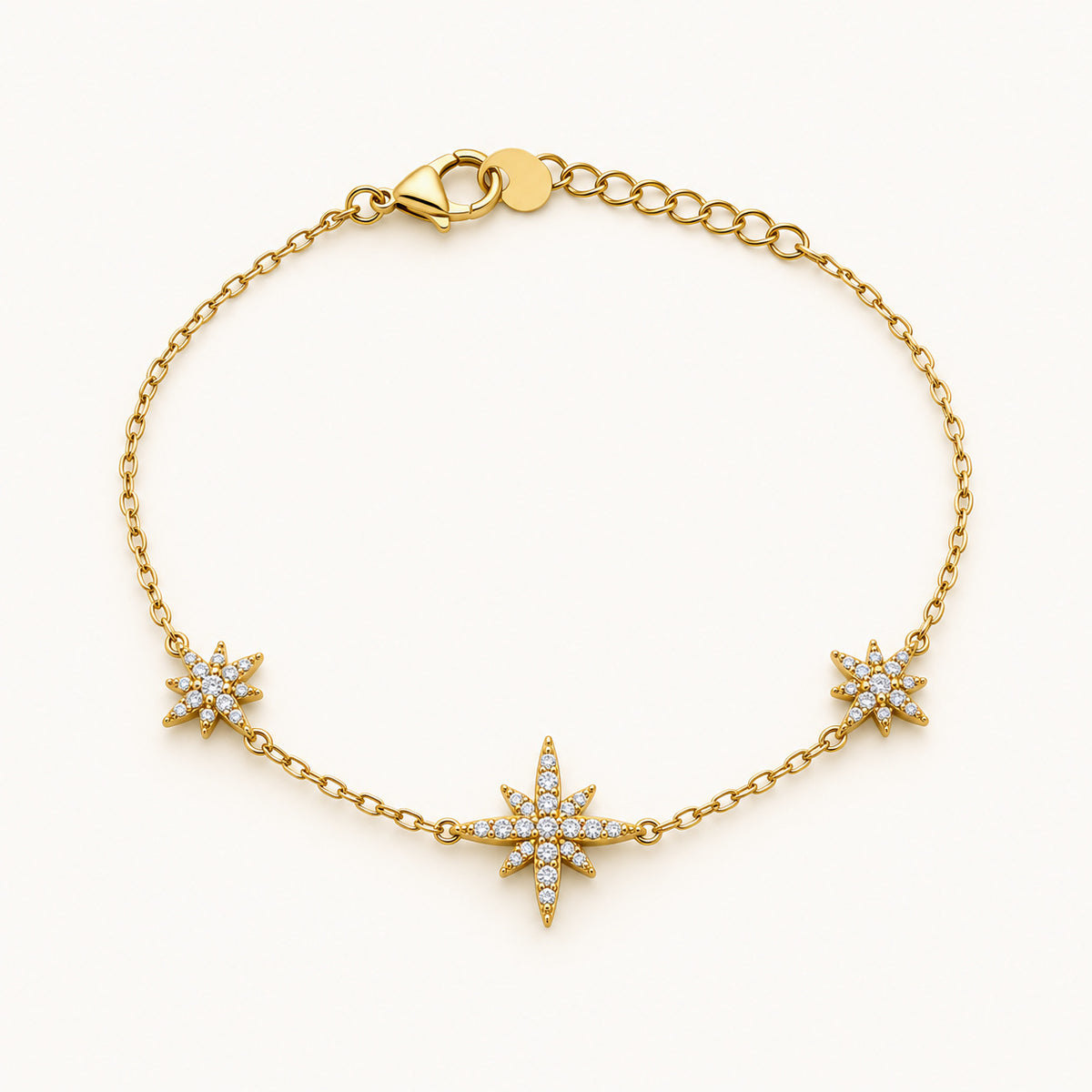 Bracelet Eclair doré, trois étoiles pavées de strass sur chaîne fine